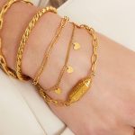 Dubbel armbandje met hartjes goud/zilver